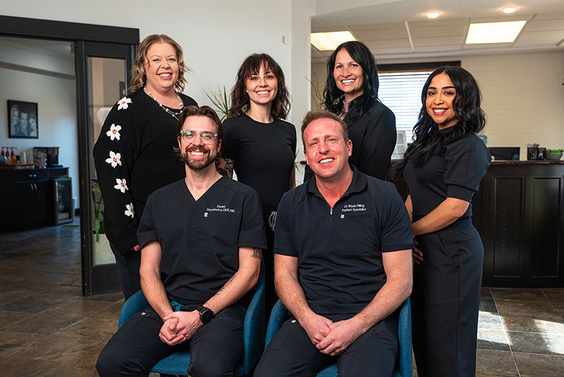 Doctor and his team smiling